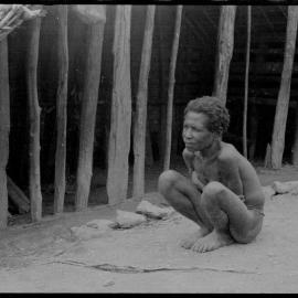 Woman Sitting Outside a Building