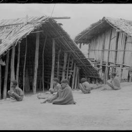 Group Sitting Outside a Building