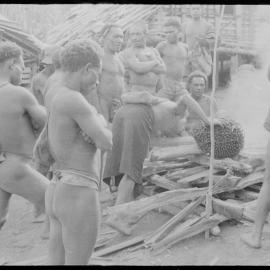 Placing Pandanus Nut on Fire