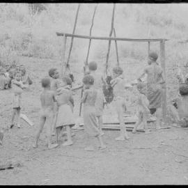Children Preparing Pigs for a Ceremony