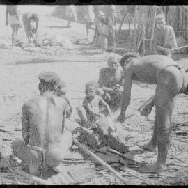 Group Preparing Pigs for a Ceremony