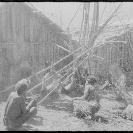 Group Preparing Pigs for a Ceremony