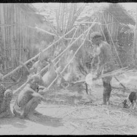 Group Preparing Pigs for a Ceremony