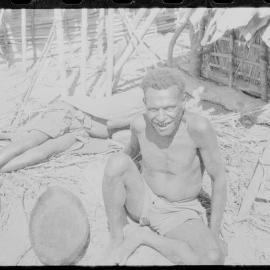 Man Sitting Outside a Building