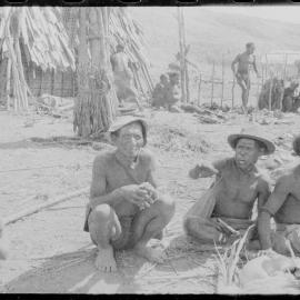 Group Sitting Outside a Building