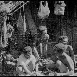 Group Sitting Outside a Building
