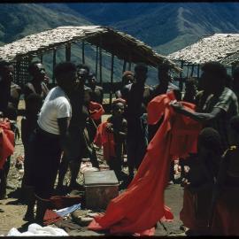 Group Unpacking Red Cloth