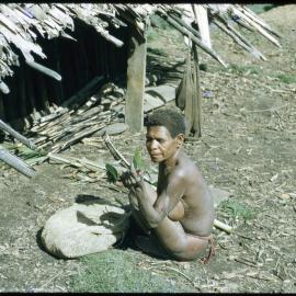 Woman Sitting Outside a Building