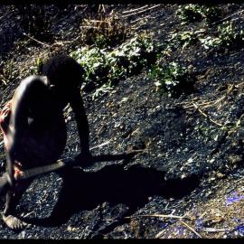 Woman Digging in Soil
