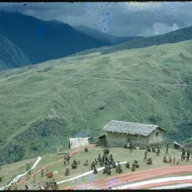 Village on Mountainside with Lengths of Cloth