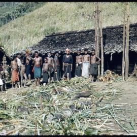Group Standing with Slaughtered Pigs