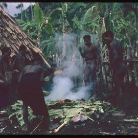 Group of Men Building a Fire