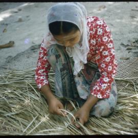 Woman Making a Pandanus Mat