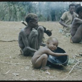 Men and Women Sitting with Baby