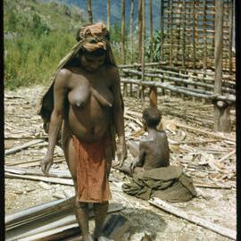Woman Standing Before a Partially Constructed Building