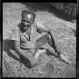 Man Sitting Outside a Building