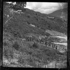 Group Walking Along Mountainside