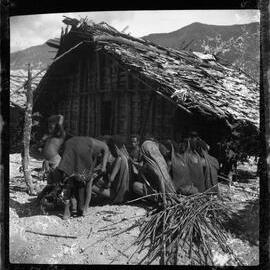 Group Sitting Outside a Building