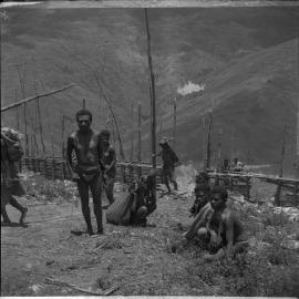 Group Passing Through Gate on Mountainside