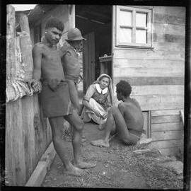 Sister and Three Men Outside Building