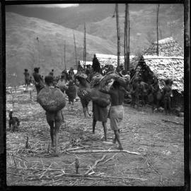 Group Carrying Pork and Net Bags