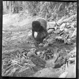 Woman with Net Bag of Vegetables