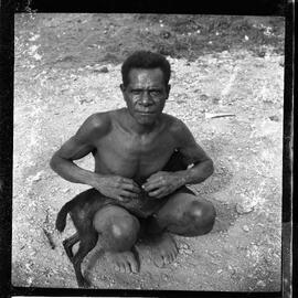 Man Sitting with a Dog