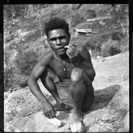 Man Sitting on Mountainside
