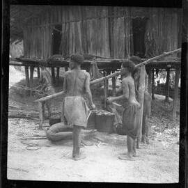 Women Beside Cooking Pots