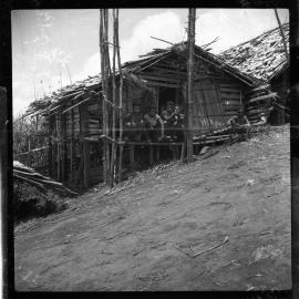 Group Sitting on Building Porch