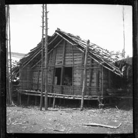 Two Children in Window of Building
