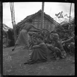 Group Sitting Outside Buildings