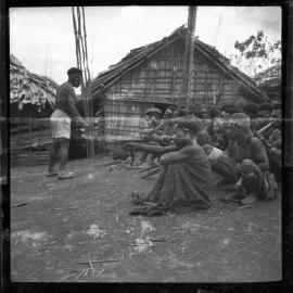 Group Sitting Outside Buildings