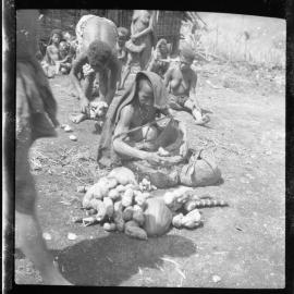 Woman with Net Bag of Vegetables
