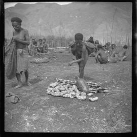 Women Standing with Pile of Vegetables