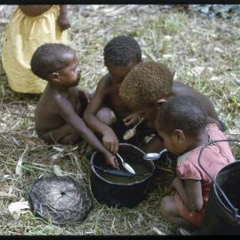 Children Eating from Pot