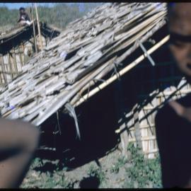 Child Standing Outside a Building