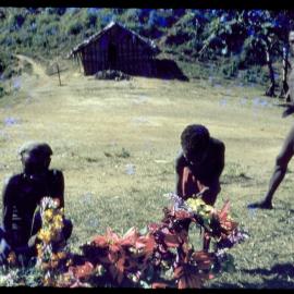 Men and Child Gathering Flowers