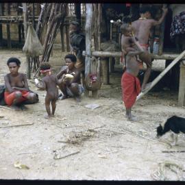 Women and Children Gathered Outside a Building