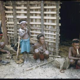 Women and Children Outside a Building