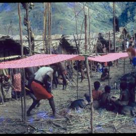 Red Cloth Suspended Through Village