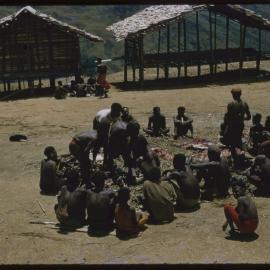 Group Gathered Around Butchered Pigs