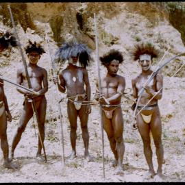 Men Standing with Bows