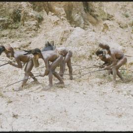 Men Posing with Bows