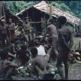 Group of Men Distributing Food