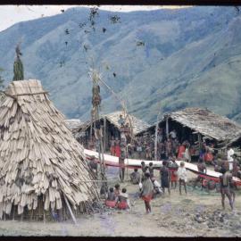Groups Gathered in Village, with Lengths of Cloth