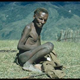 Man Sitting on Mountainside