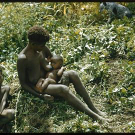 Woman Sitting with Two Children