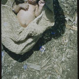 Baby Resting in a Net Carrier
