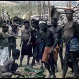 Group of Men Gathered Outside Buildings